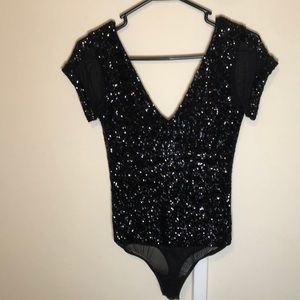 Black sequin bodysuit/leotard.